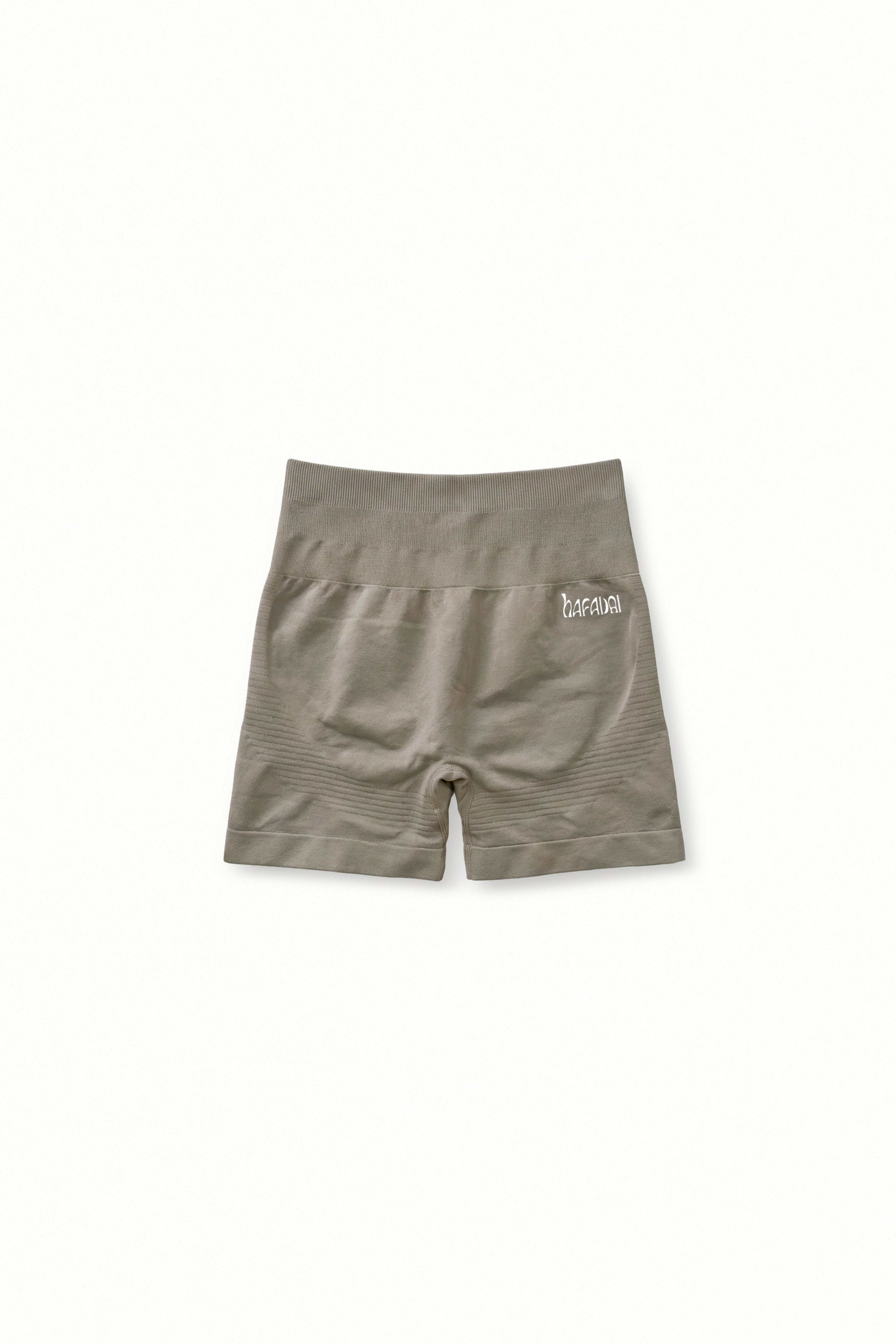 Brown shorts with a brand logo on a white background